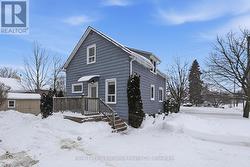 Entrance off driveway is for the upstairs unit -