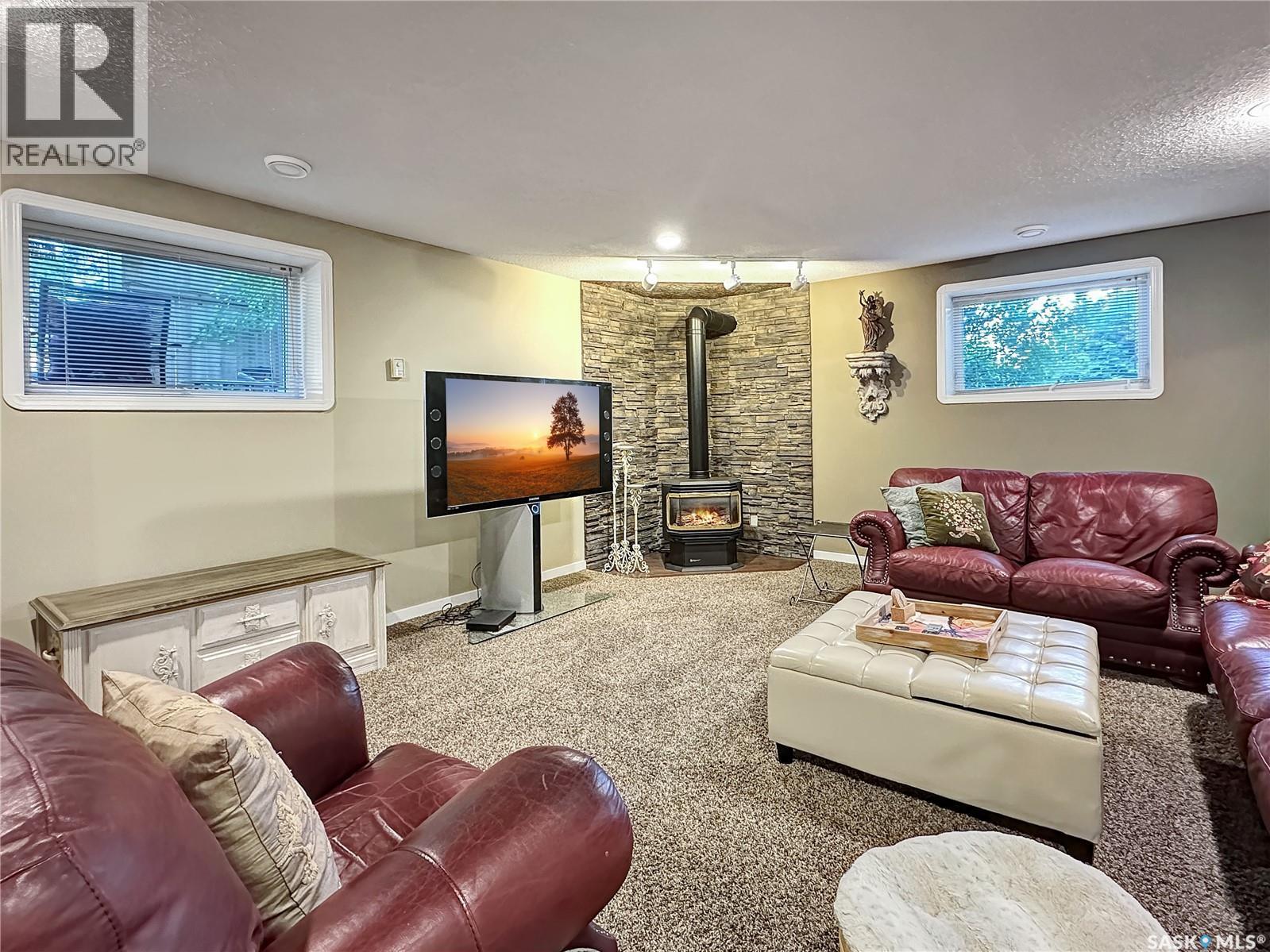 110 Sunset Crescent, Balcarres, SK - Indoor Photo Showing Living Room With Fireplace