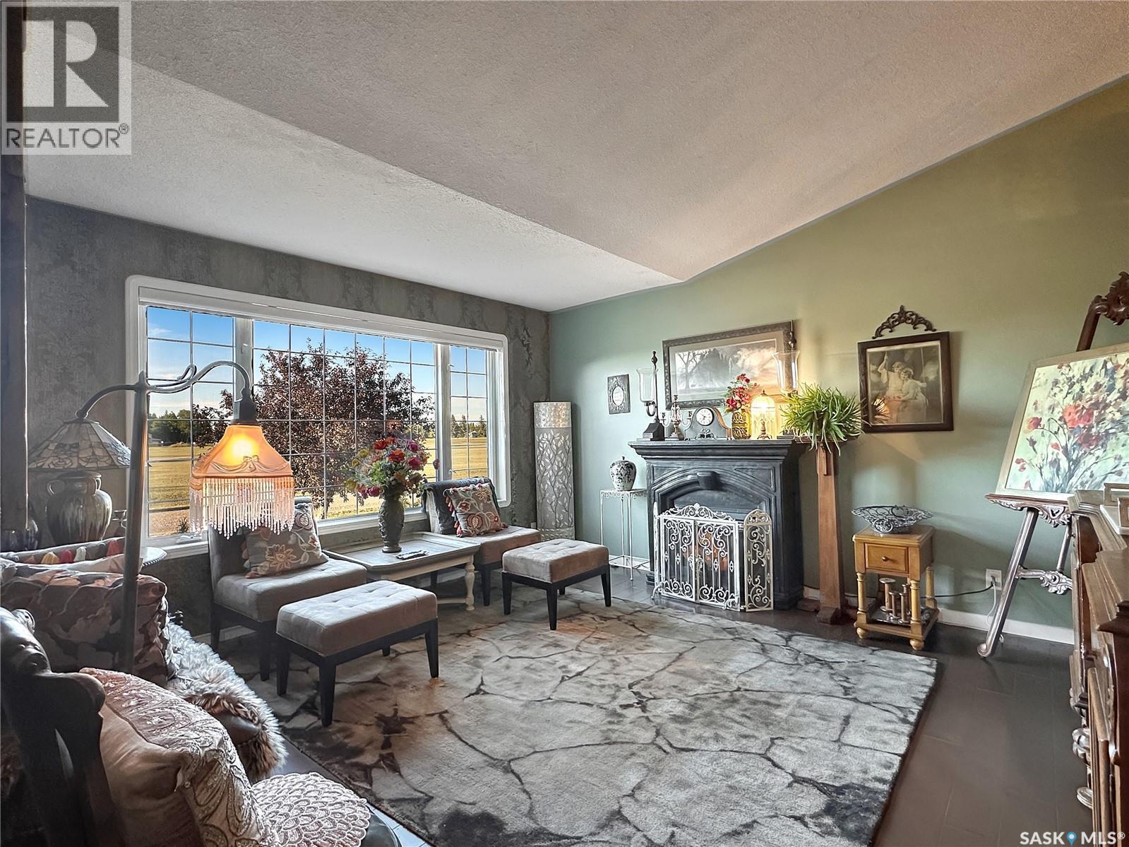110 Sunset Crescent, Balcarres, SK - Indoor Photo Showing Living Room With Fireplace