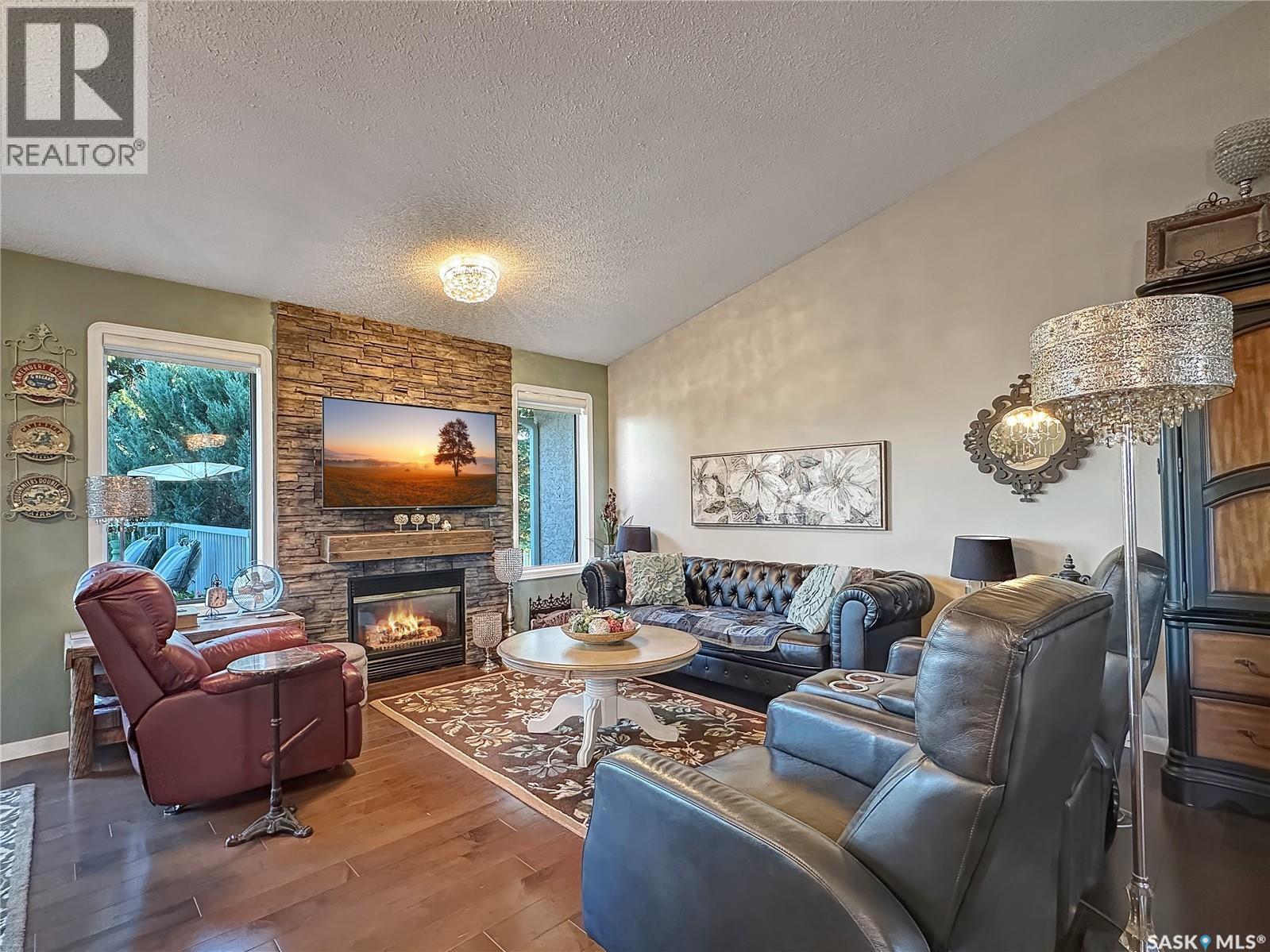 110 Sunset Crescent, Balcarres, SK - Indoor Photo Showing Living Room With Fireplace