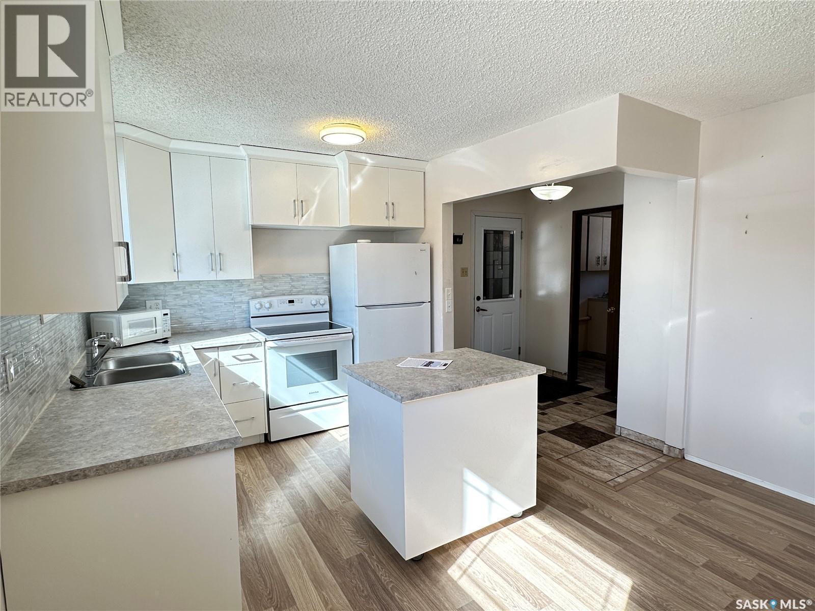 44 Campbell Place, Clavet, SK - Indoor Photo Showing Kitchen With Double Sink
