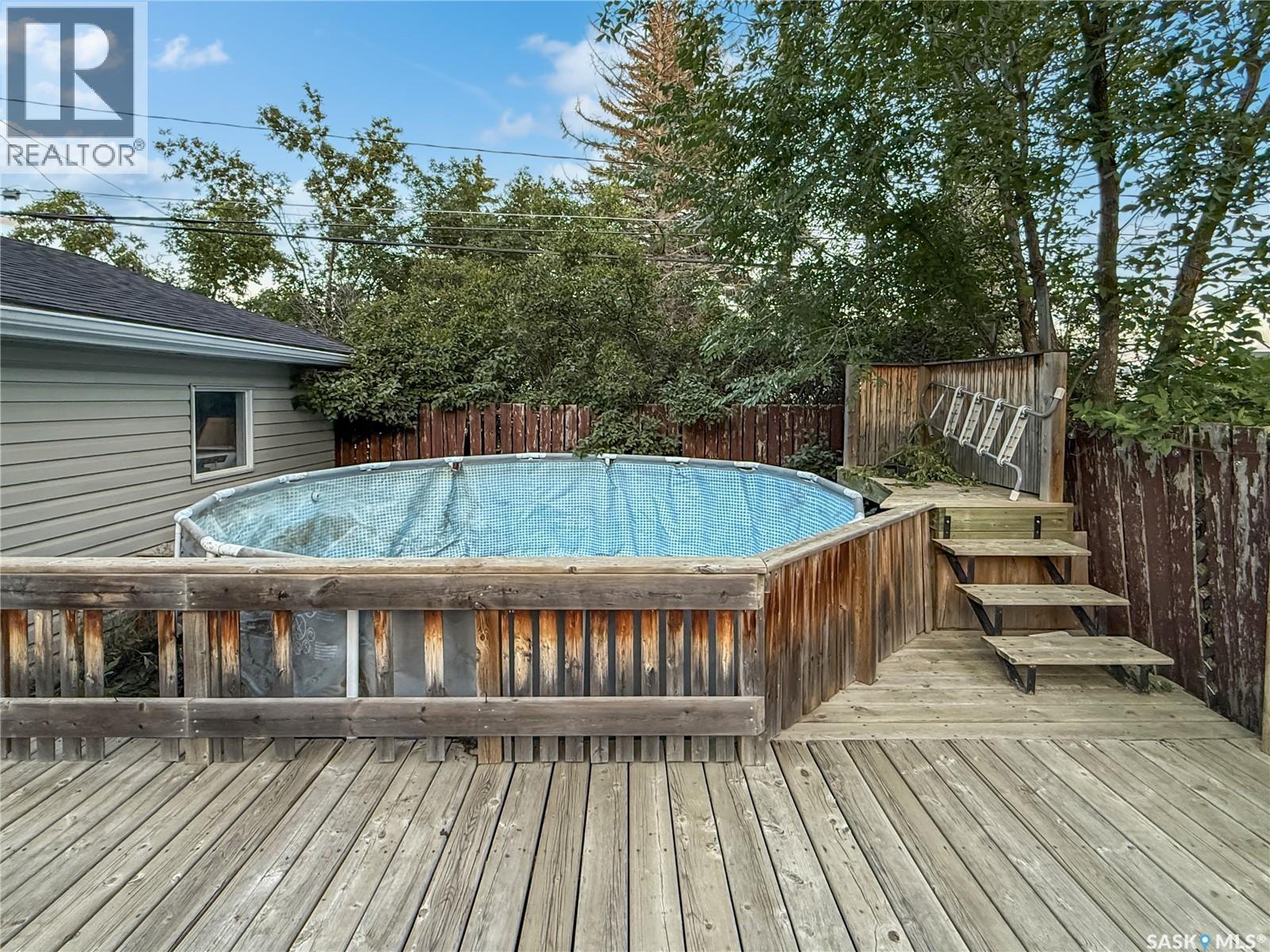 371 6Th Avenue Nw, Swift Current, SK - Outdoor With Above Ground Pool With Deck Patio Veranda