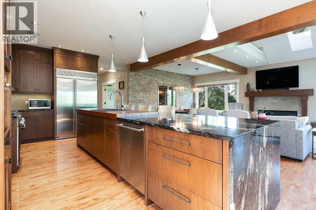 664 29 Avenue Nw, Calgary, AB - Indoor Photo Showing Kitchen With Fireplace With Stainless Steel Kitchen With Upgraded Kitchen