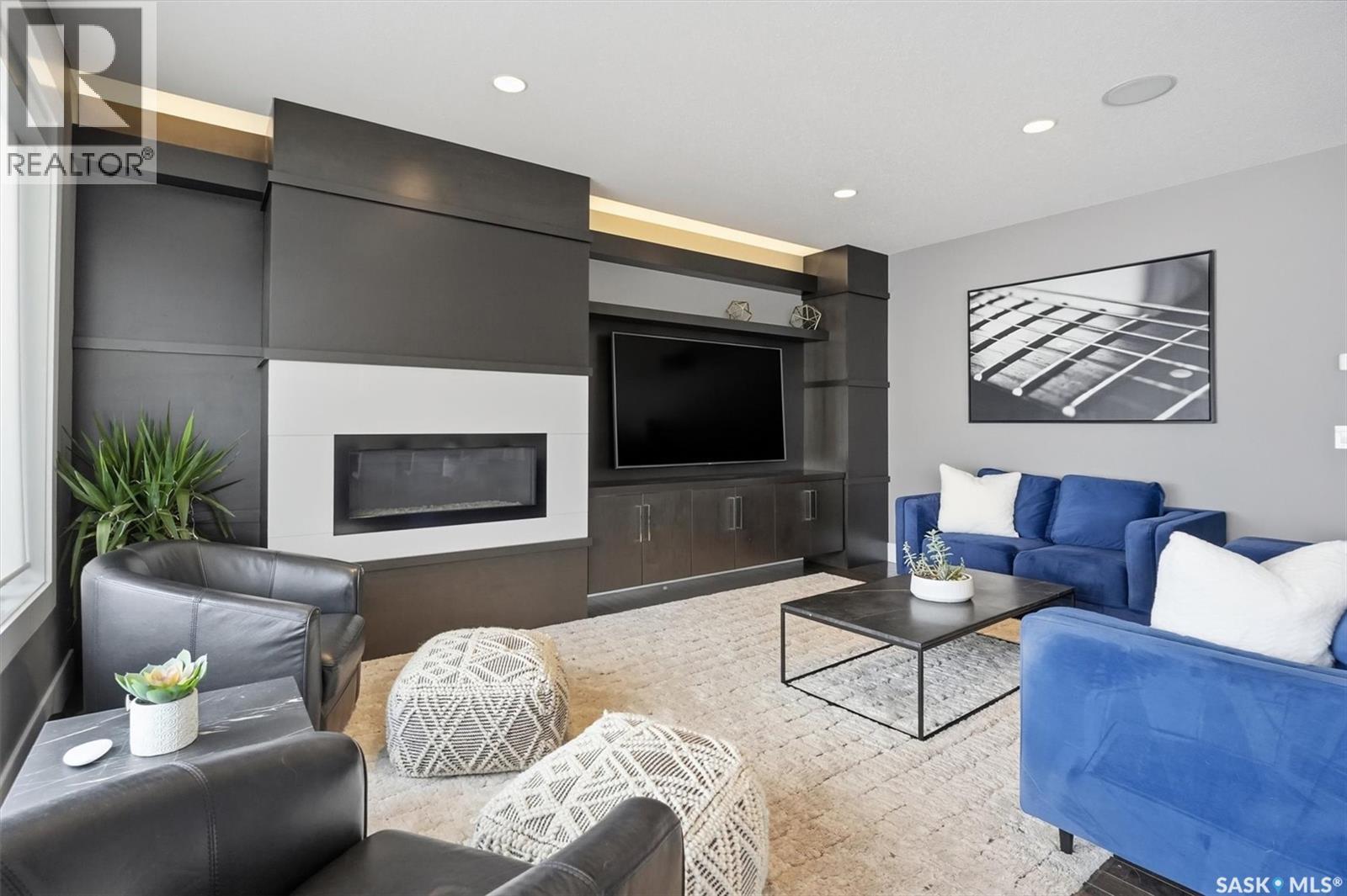 343 Mahabir Court, Saskatoon, SK - Indoor Photo Showing Living Room With Fireplace