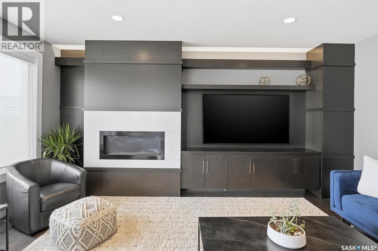 343 Mahabir Court, Saskatoon, SK - Indoor Photo Showing Living Room With Fireplace