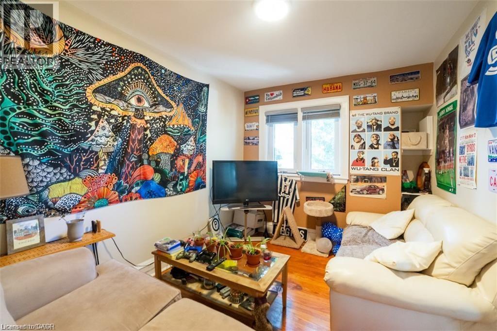 Living area with wood finished floors - 41 Paradise Road S, Hamilton, ON - Indoor Photo Showing Other Room