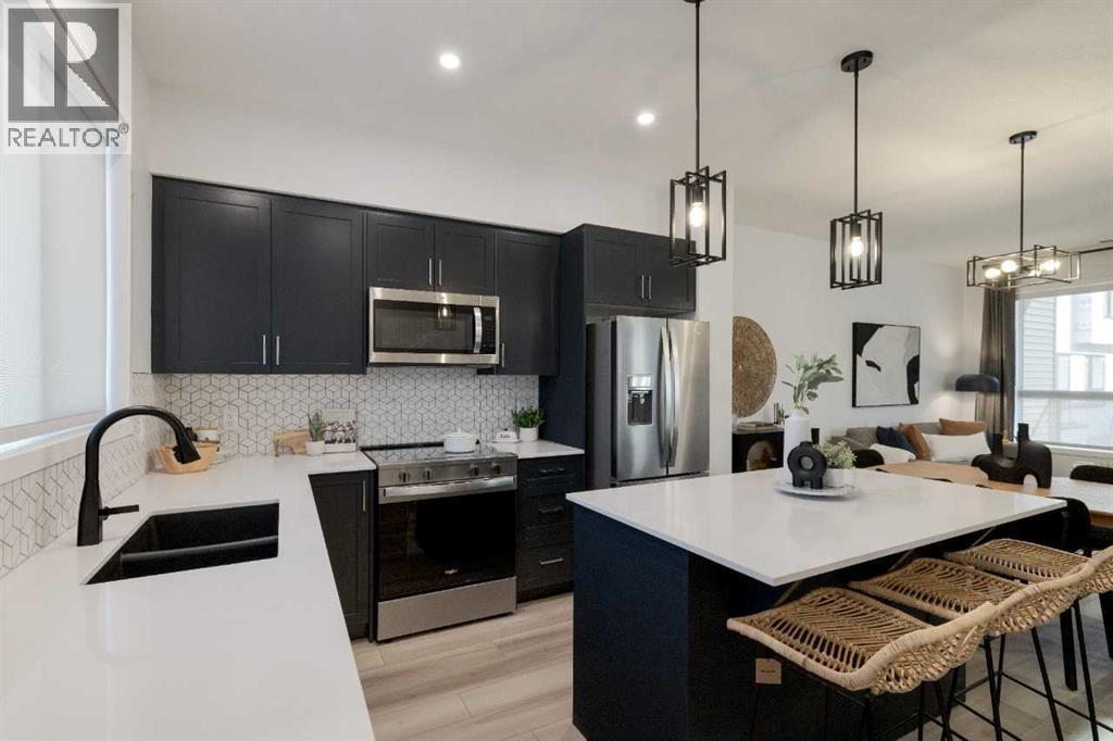 209, 81 Midtown Boulevard Sw, Airdrie, AB - Indoor Photo Showing Kitchen With Double Sink With Upgraded Kitchen