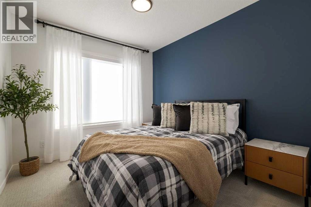 209, 81 Midtown Boulevard Sw, Airdrie, AB - Indoor Photo Showing Bedroom