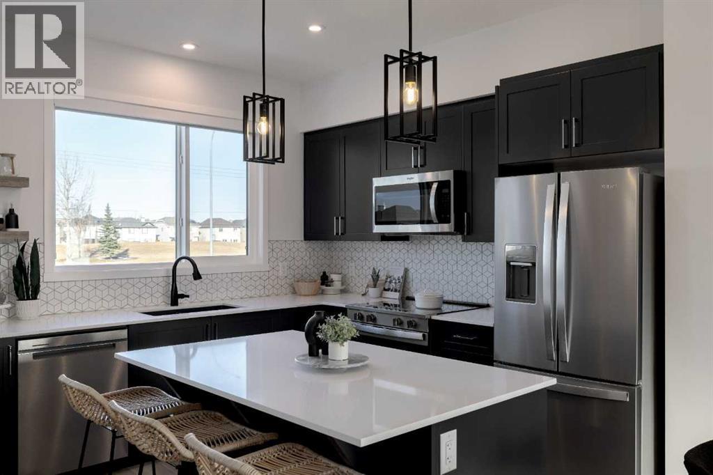 209, 81 Midtown Boulevard Sw, Airdrie, AB - Indoor Photo Showing Kitchen With Upgraded Kitchen