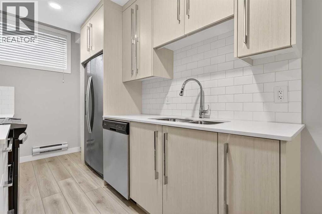 128 Corner Meadows Gate Ne, Calgary, AB - Indoor Photo Showing Kitchen With Double Sink