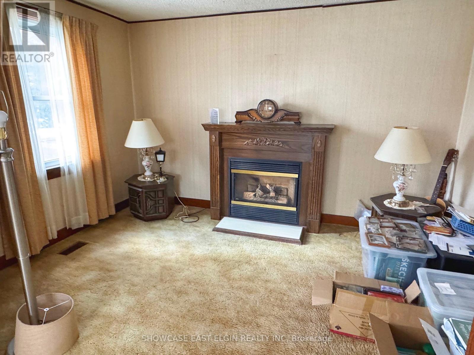 9106 Powers Road, Central Elgin, ON - Indoor Photo Showing Other Room With Fireplace