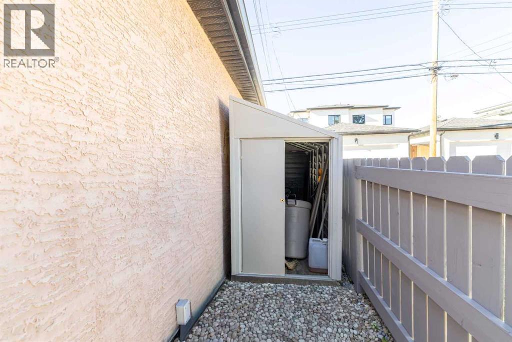 tool shed and new painted fence - 1421 40 Street Sw, Calgary, AB - Outdoor With Exterior