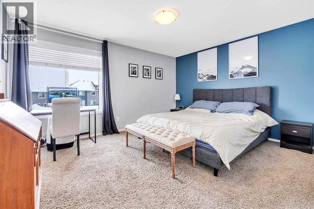 85 Reynolds Road, Sylvan Lake, AB - Indoor Photo Showing Bedroom