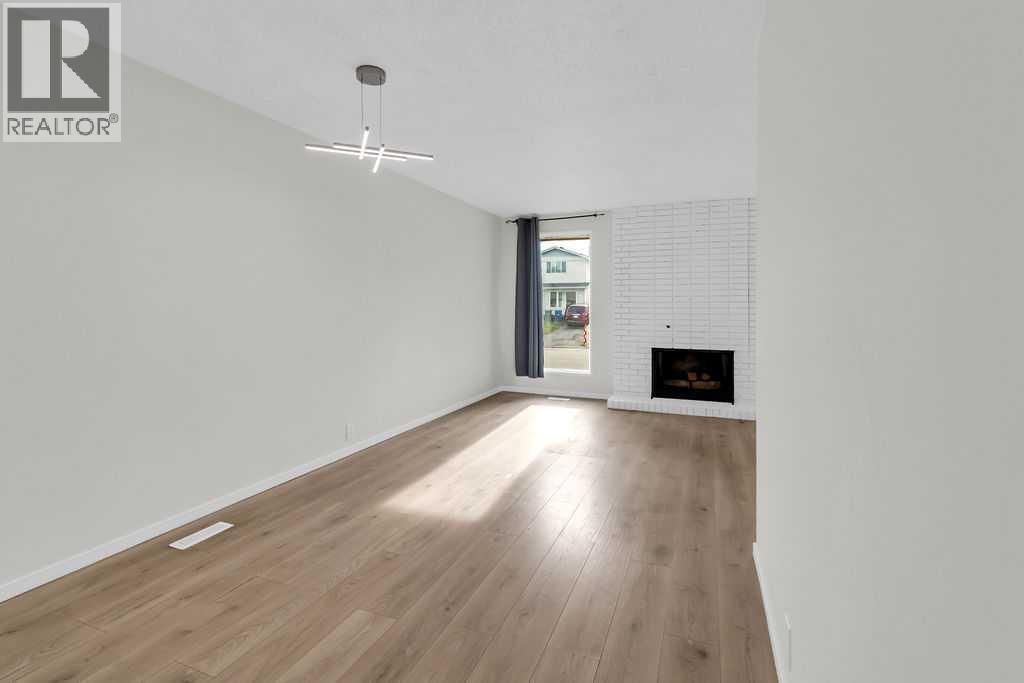 10 Radcliffe Crescent Se, Calgary, AB - Indoor With Fireplace