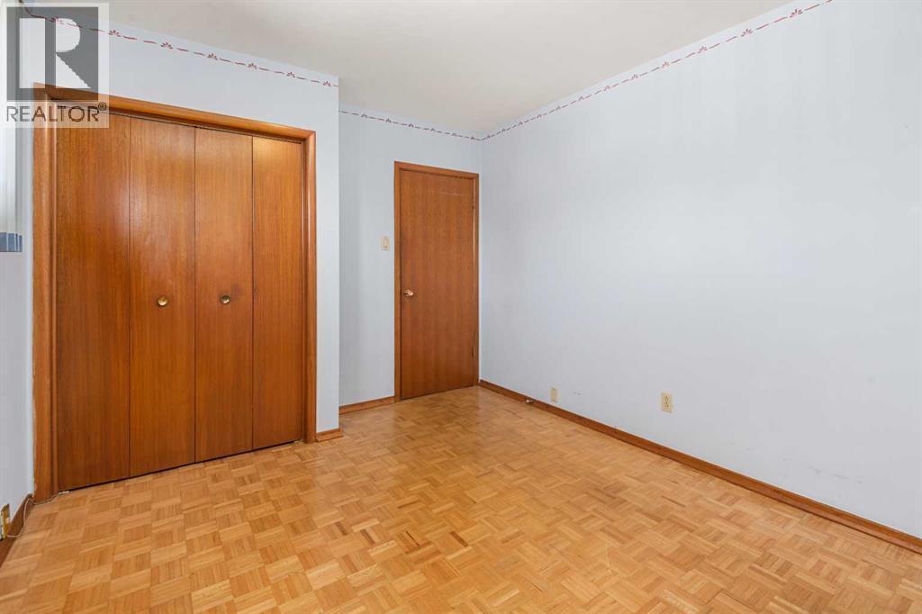 2nd Bedroom - Main Floor - 1423 18A Street Ne, Calgary, AB - Indoor Photo Showing Other Room