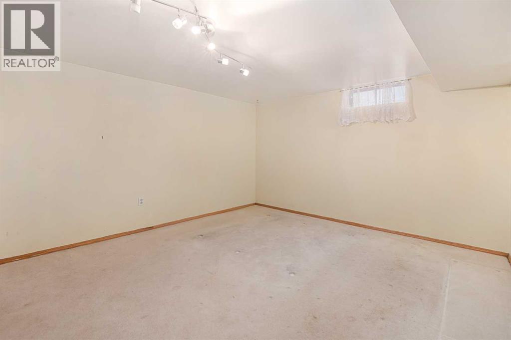 Bedroom 4 - Basement ( Large Room 16' x 12'2") - 1423 18A Street Ne, Calgary, AB - Indoor Photo Showing Other Room