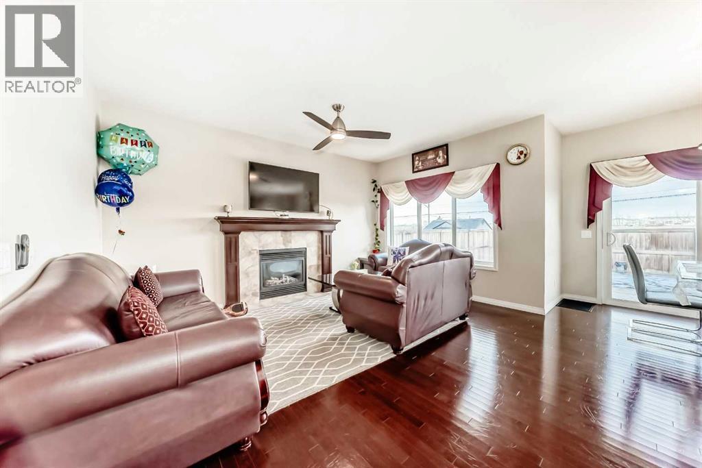 71 Martha'S Meadow Close Ne, Calgary, AB - Indoor Photo Showing Living Room With Fireplace