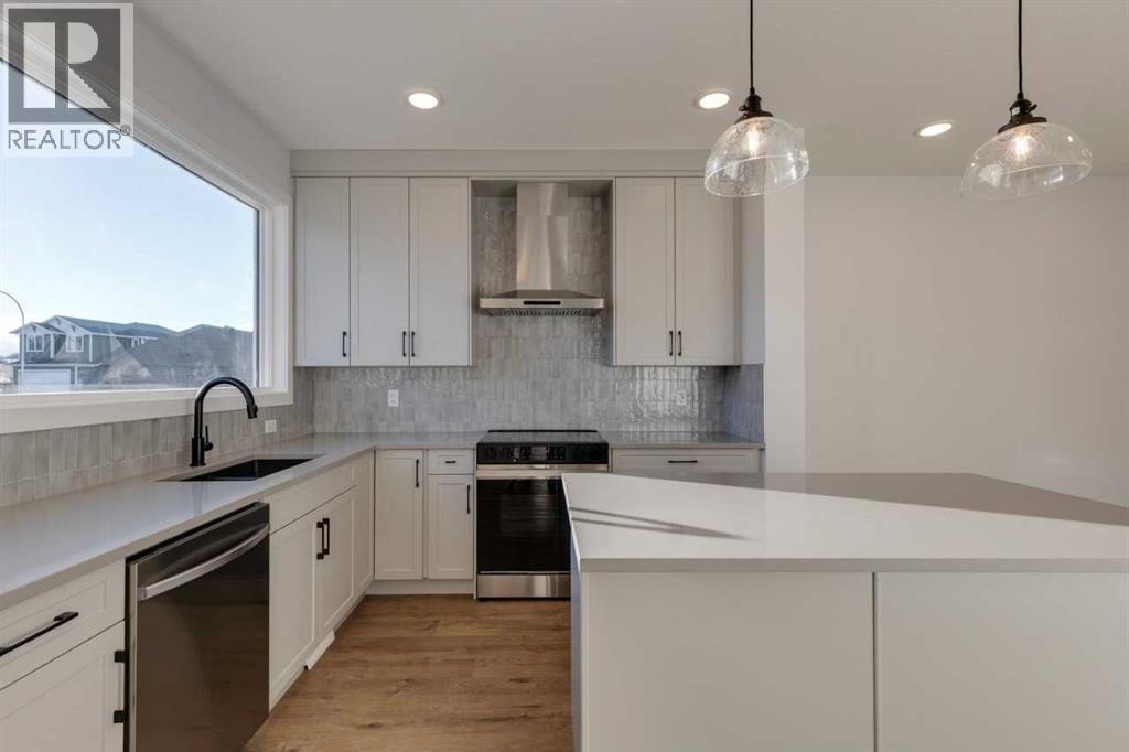 367 Fireside Drive, Cochrane, AB - Indoor Photo Showing Kitchen With Upgraded Kitchen