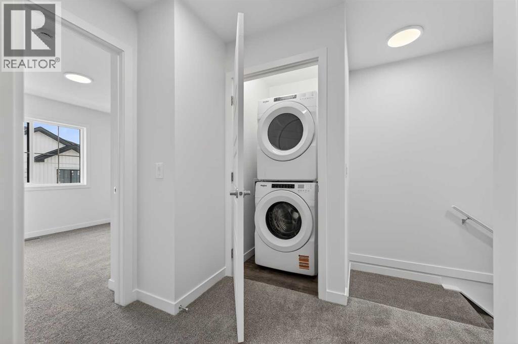 Laundry area - 64 Creekside Drive Sw, Calgary, AB - Indoor Photo Showing Laundry Room