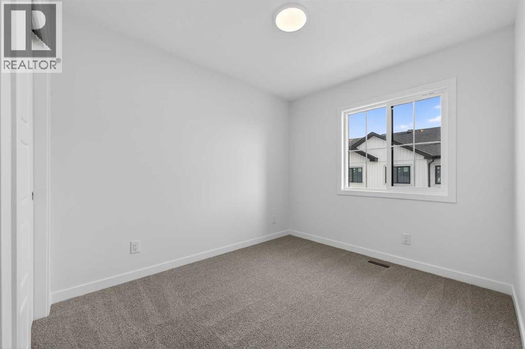 2nd bedroom - 64 Creekside Drive Sw, Calgary, AB - Indoor Photo Showing Other Room