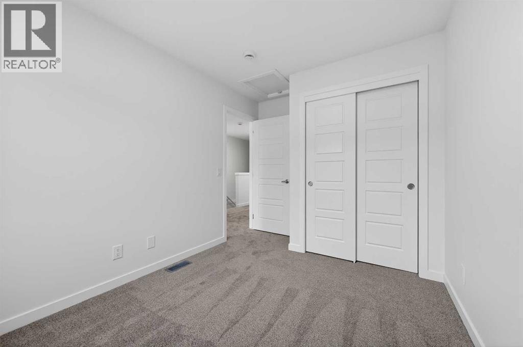 2nd bedroom - 64 Creekside Drive Sw, Calgary, AB - Indoor Photo Showing Other Room