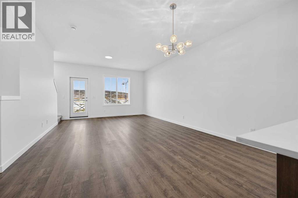 Living area - 64 Creekside Drive Sw, Calgary, AB - Indoor