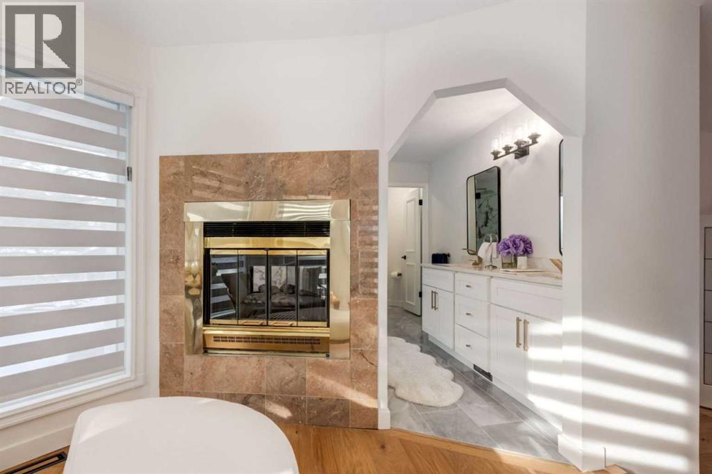 113 Straddock Terrace Sw, Calgary, AB - Indoor With Fireplace