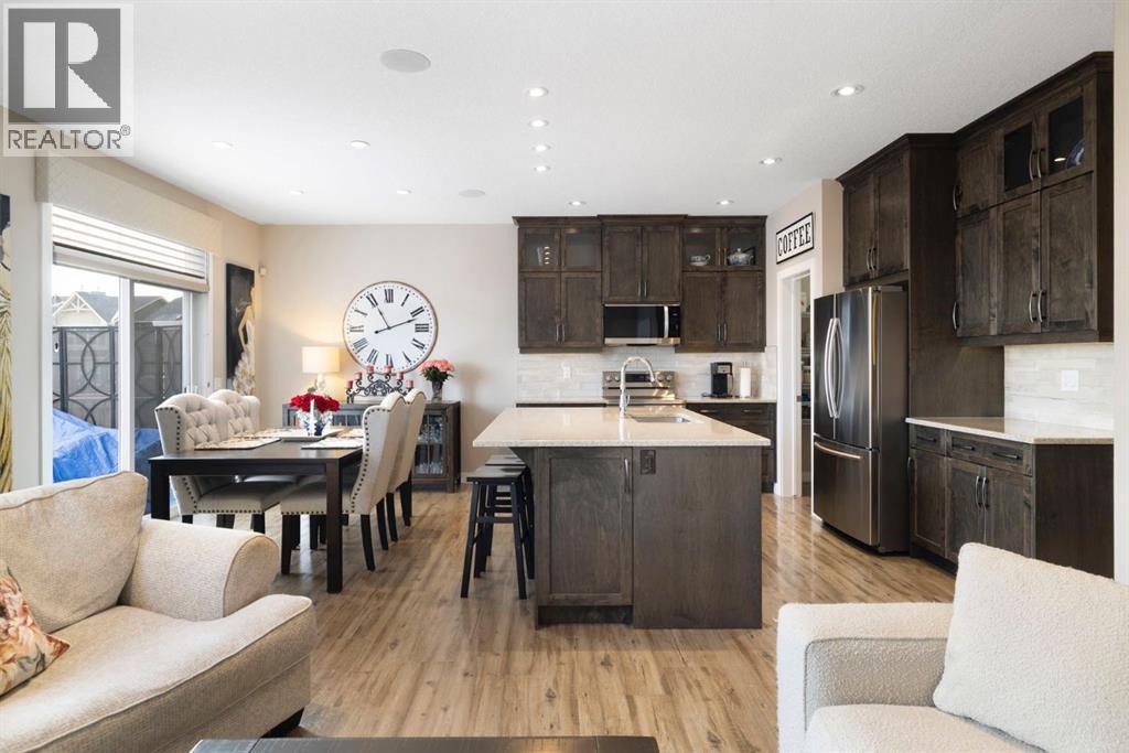 8 Emberside Glen, Cochrane, AB - Indoor Photo Showing Kitchen With Stainless Steel Kitchen With Upgraded Kitchen