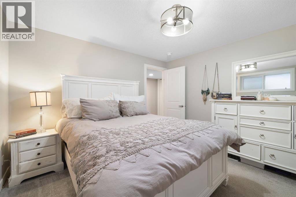 8 Emberside Glen, Cochrane, AB - Indoor Photo Showing Bedroom