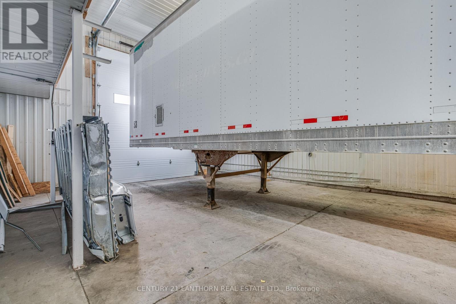 large bay with 14' drive in door - 19 Terry Fox Drive, Champlain, ON