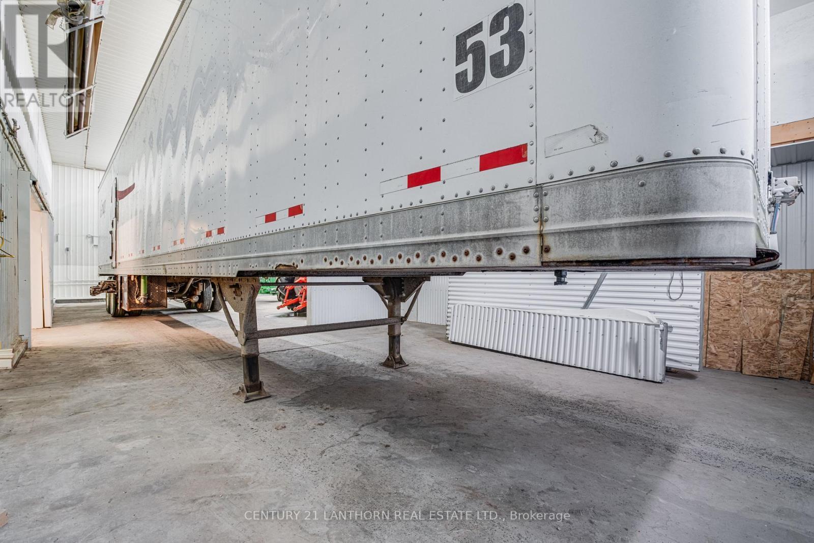 large bay with 14' drive in door - 19 Terry Fox Drive, Champlain, ON