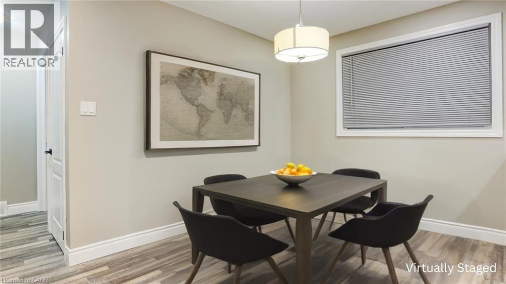 Dining space featuring baseboards and light wood-type flooring - 55 Silver Aspen Crescent, Kitchener, ON - Indoor Photo Showing Dining Room