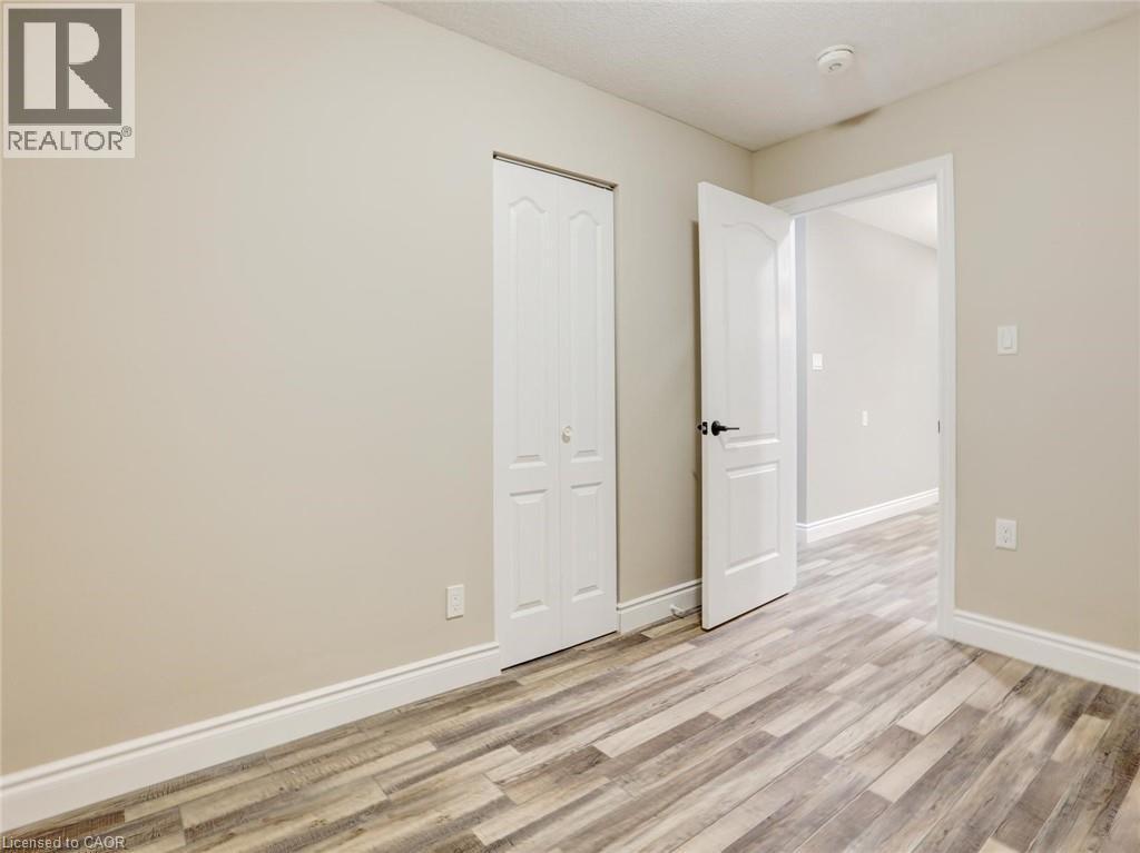 Spare room featuring light wood-style floors and baseboards - 55 Silver Aspen Crescent, Kitchener, ON - Indoor Photo Showing Other Room