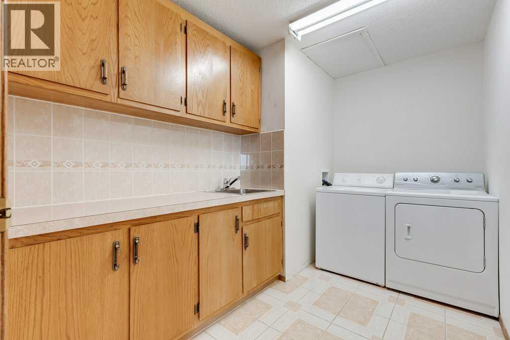 Laundry Room - 106 Sienna Hills Drive Sw, Calgary, AB - Indoor Photo Showing Laundry Room