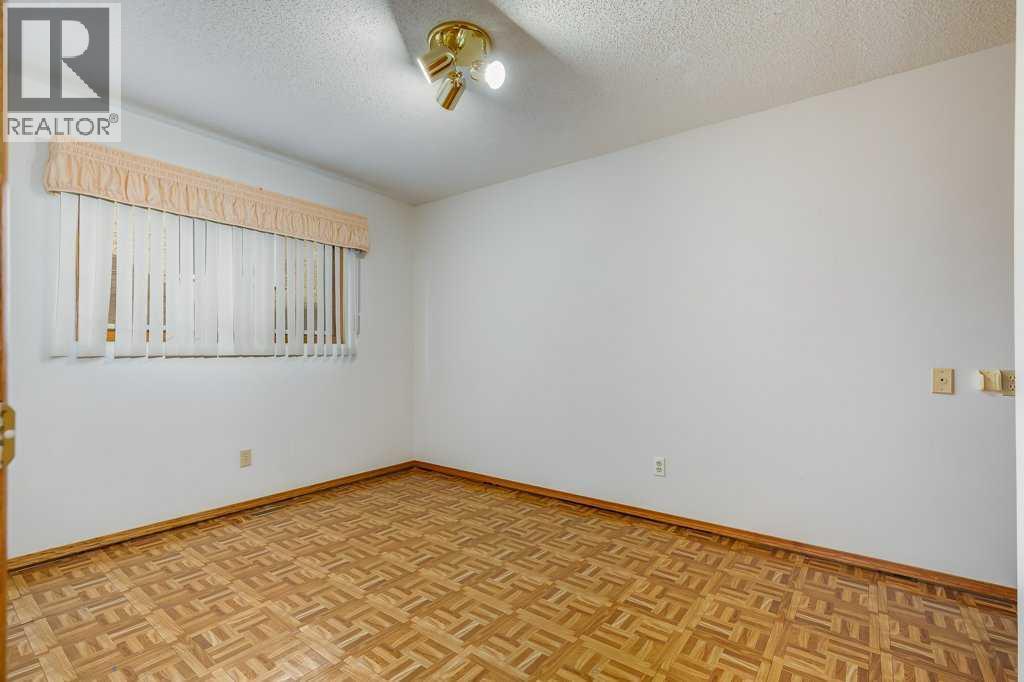 Bedroom - 106 Sienna Hills Drive Sw, Calgary, AB - Indoor Photo Showing Other Room