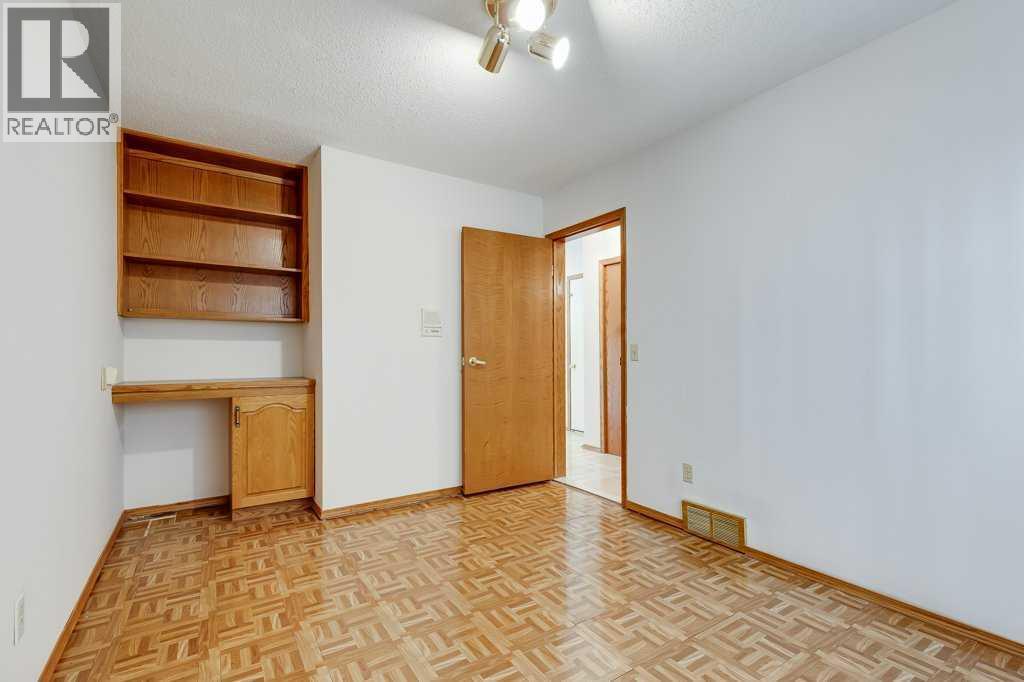 Bedroom - 106 Sienna Hills Drive Sw, Calgary, AB - Indoor Photo Showing Other Room