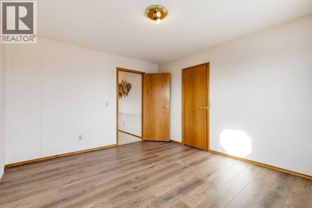 Bedroom - 106 Sienna Hills Drive Sw, Calgary, AB - Indoor Photo Showing Other Room