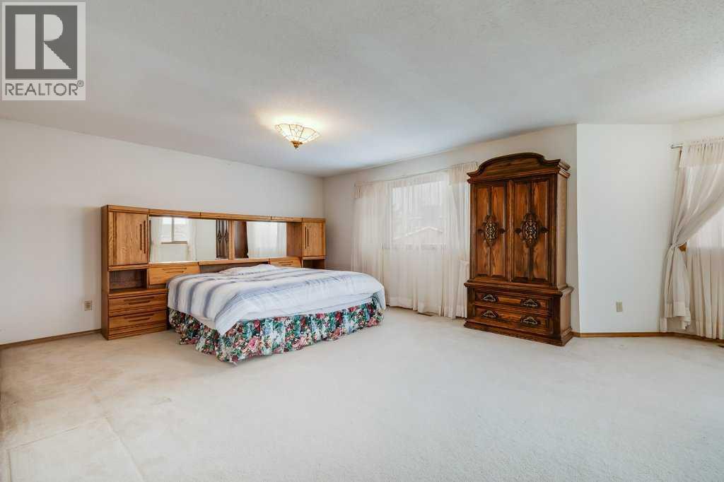 Primary Bedroom - 106 Sienna Hills Drive Sw, Calgary, AB - Indoor Photo Showing Bedroom
