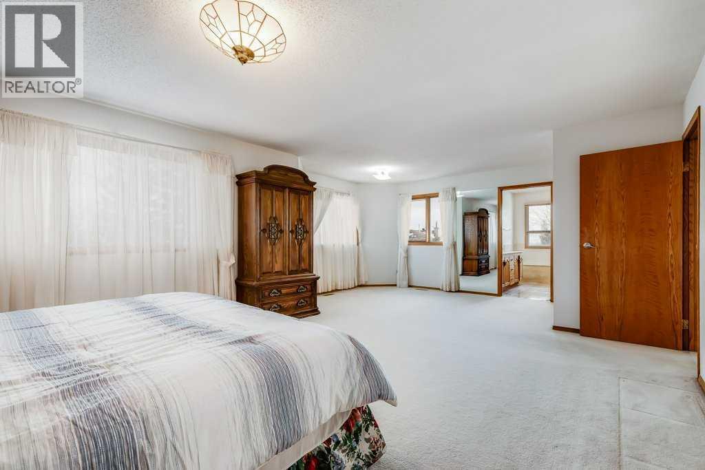 Primary Bedroom - 106 Sienna Hills Drive Sw, Calgary, AB - Indoor Photo Showing Bedroom