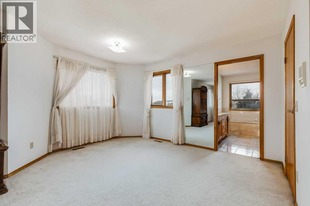 Primary Bedroom - 106 Sienna Hills Drive Sw, Calgary, AB - Indoor Photo Showing Other Room