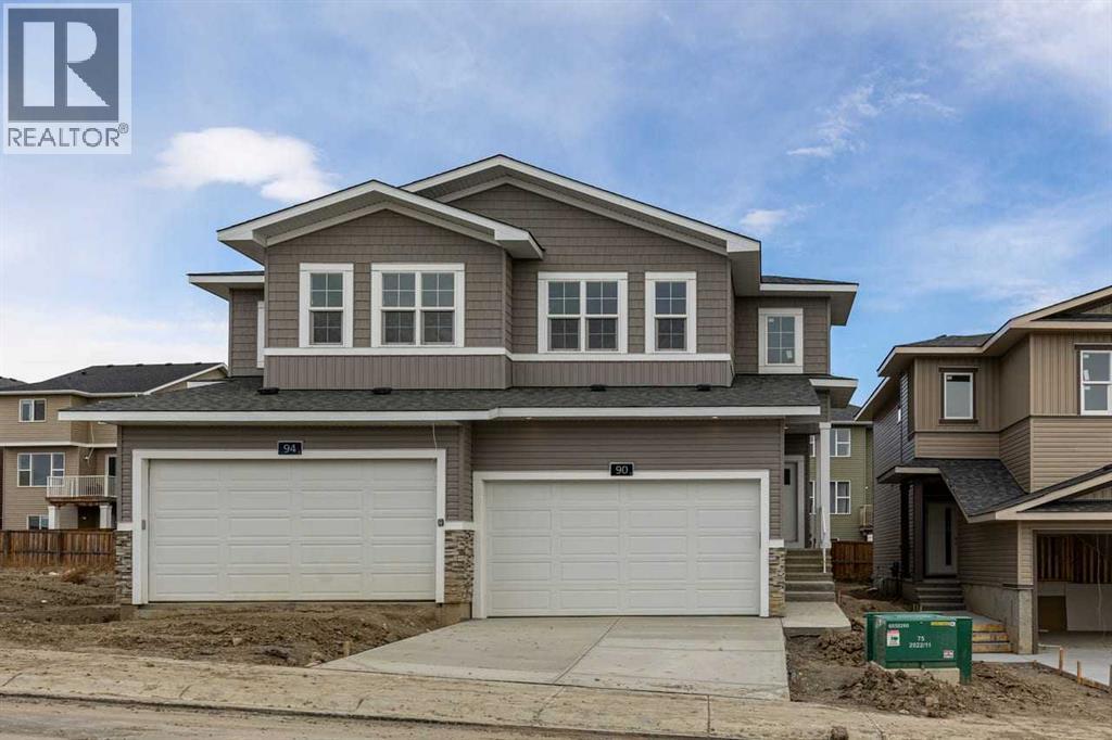 90 Heritage Circle, Cochrane, AB - Outdoor With Facade
