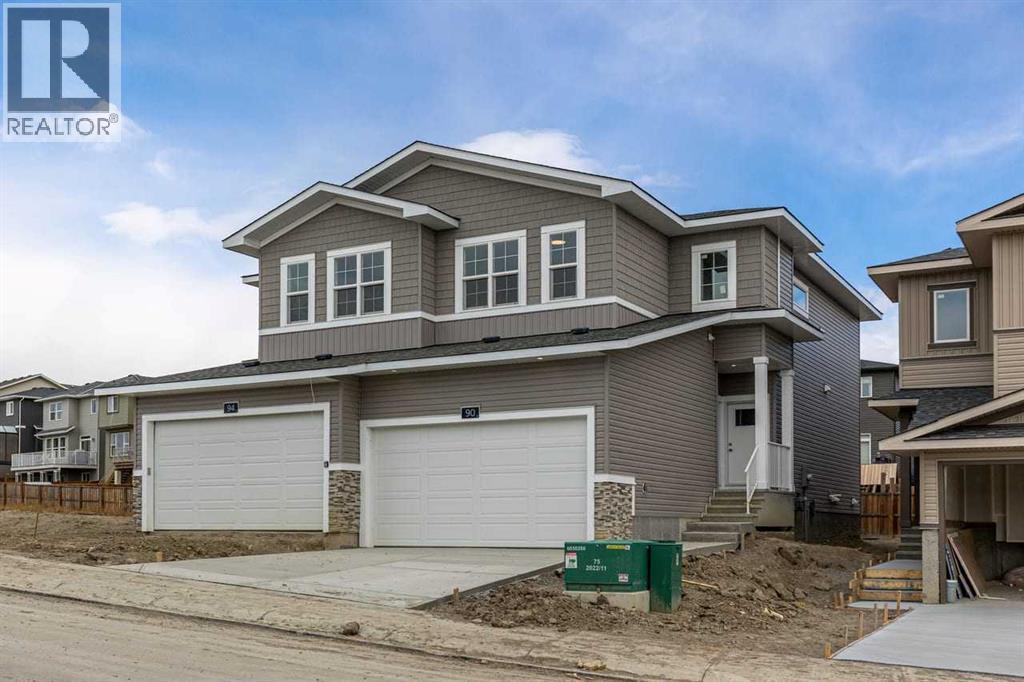 90 Heritage Circle, Cochrane, AB - Outdoor With Facade