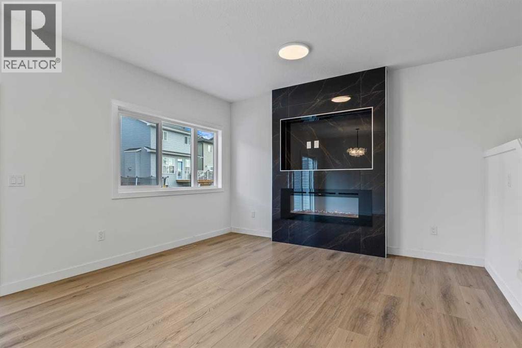 90 Heritage Circle, Cochrane, AB - Indoor With Fireplace