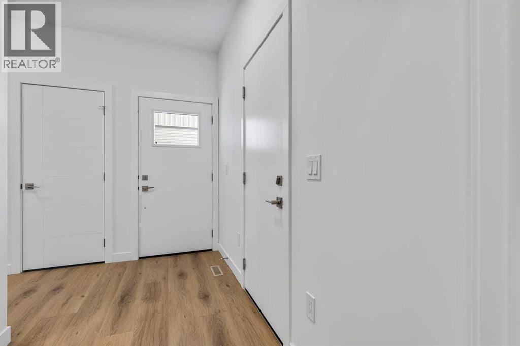 90 Heritage Circle, Cochrane, AB - Indoor Photo Showing Other Room