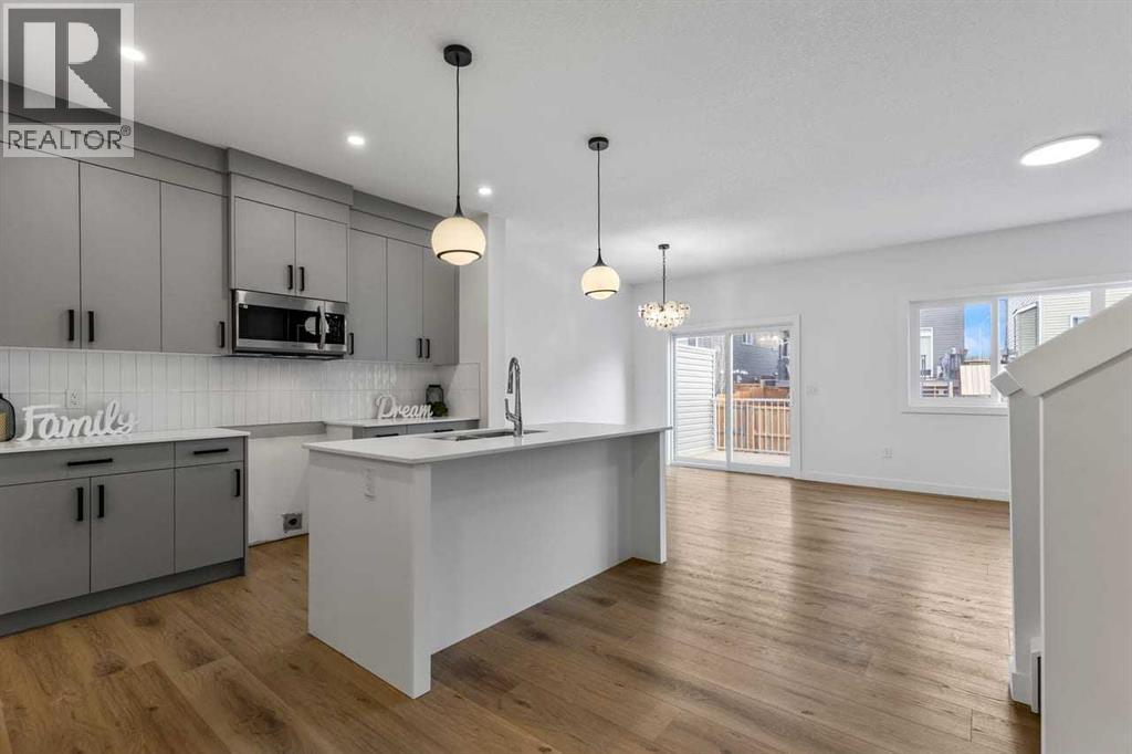 90 Heritage Circle, Cochrane, AB - Indoor Photo Showing Kitchen With Upgraded Kitchen