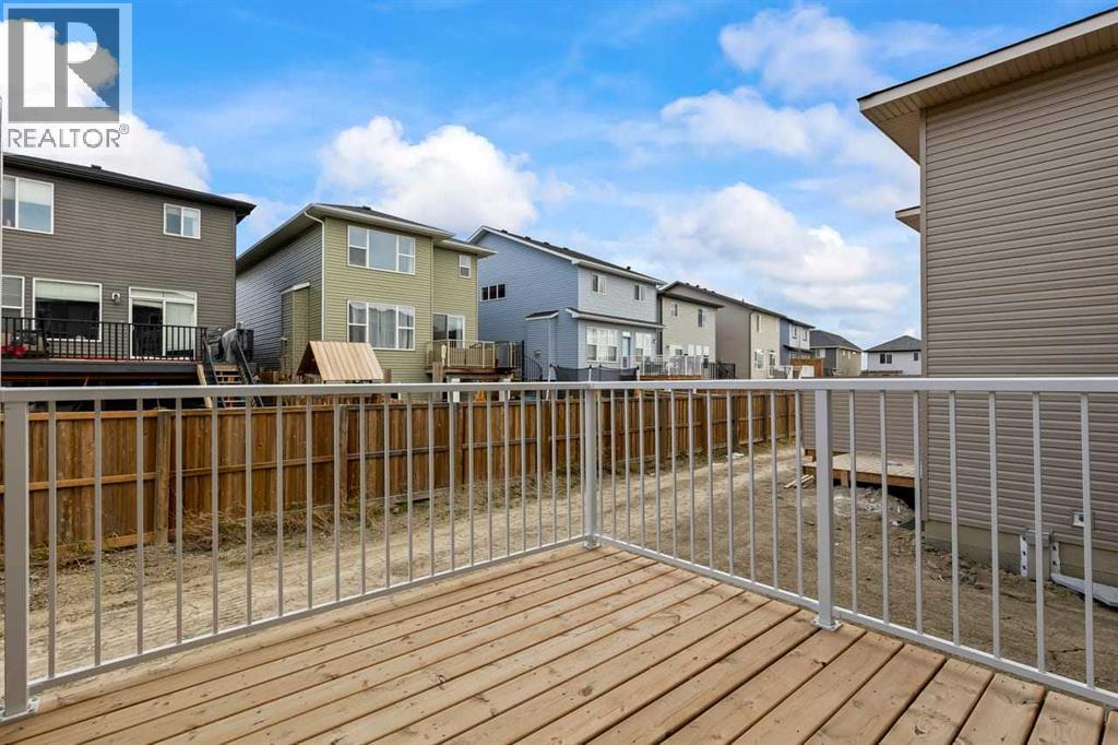 90 Heritage Circle, Cochrane, AB - Outdoor With Deck Patio Veranda With Exterior