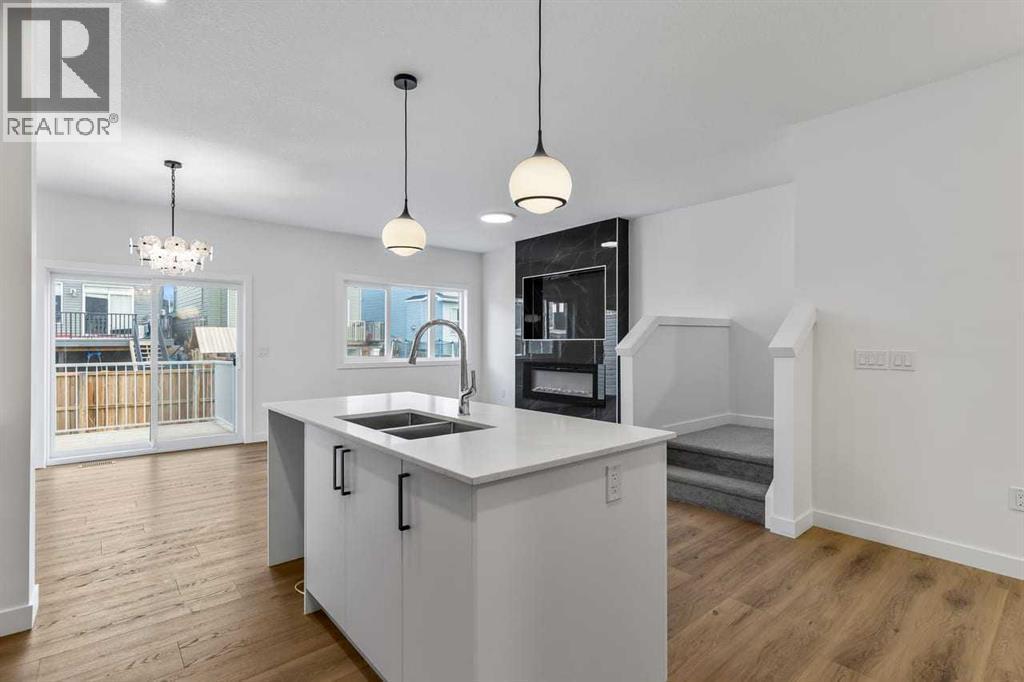 90 Heritage Circle, Cochrane, AB - Indoor Photo Showing Kitchen With Double Sink