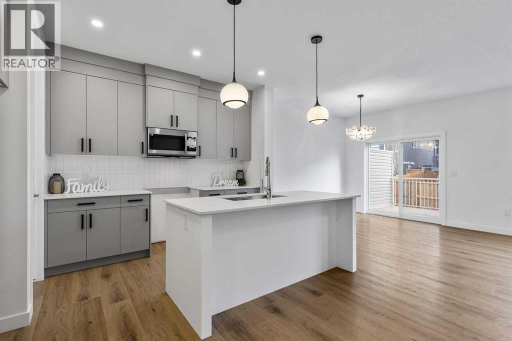 90 Heritage Circle, Cochrane, AB - Indoor Photo Showing Kitchen With Upgraded Kitchen