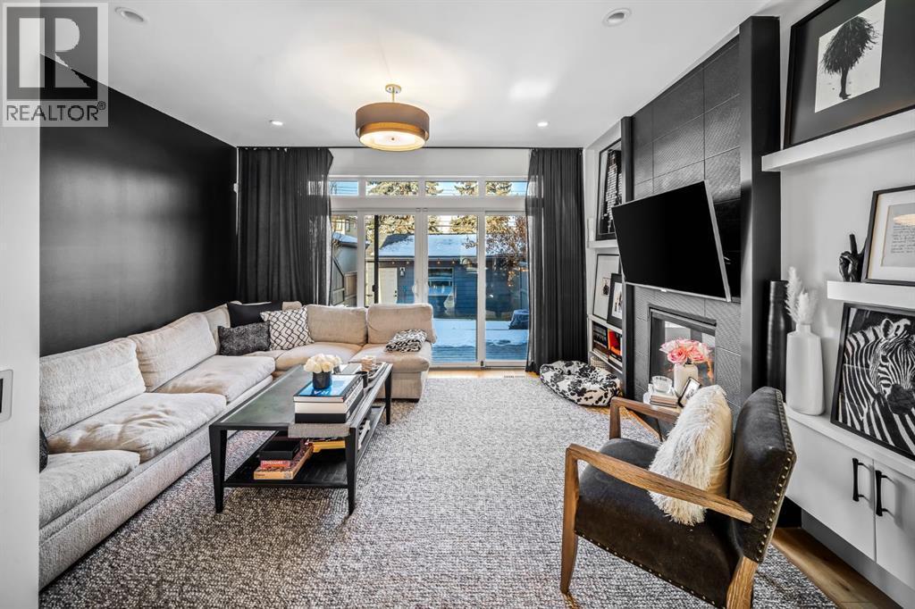 1910 48 Avenue Sw, Calgary, AB - Indoor Photo Showing Living Room With Fireplace