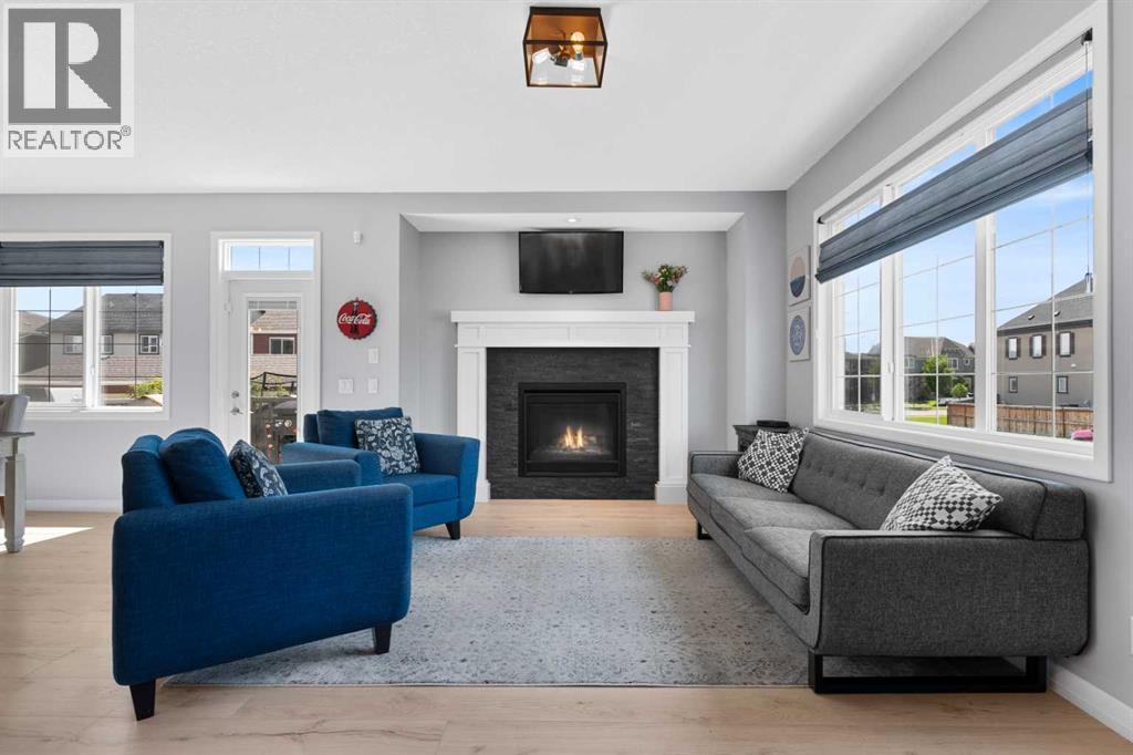103 Masters Rise Se, Calgary, AB - Indoor Photo Showing Living Room With Fireplace